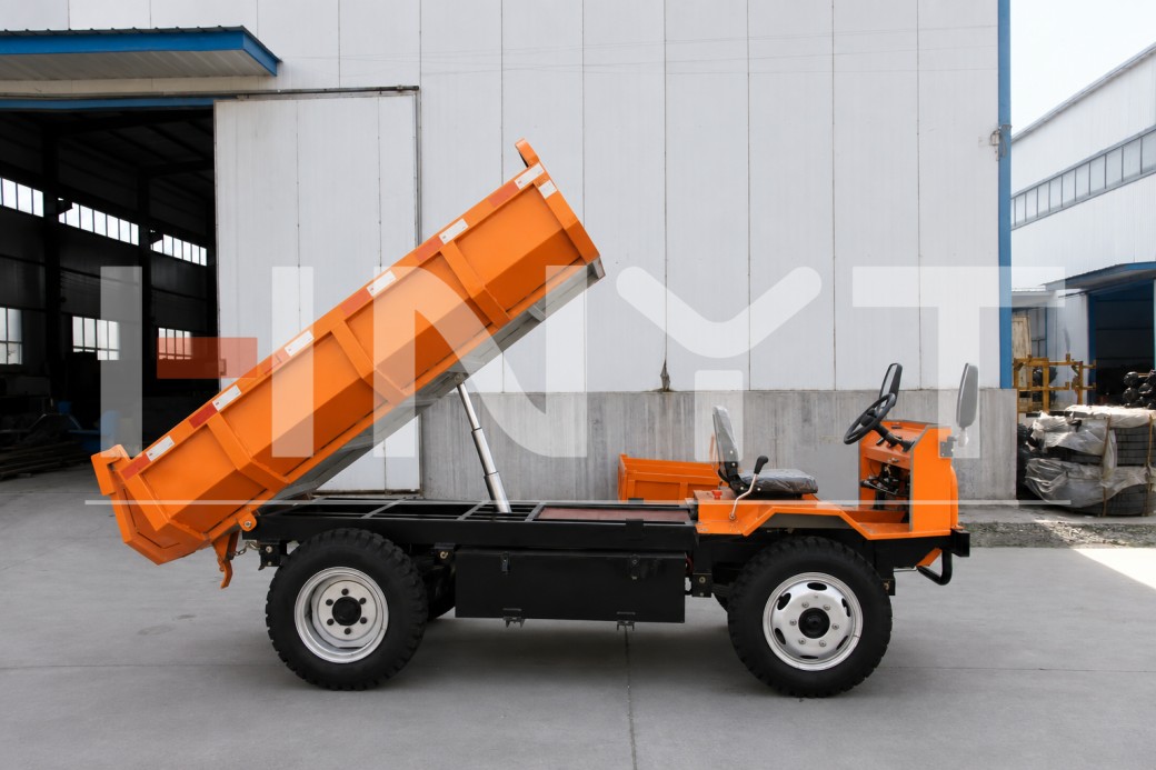 Mining dump truck with the cargo raised for hydraulic inspection.jpg