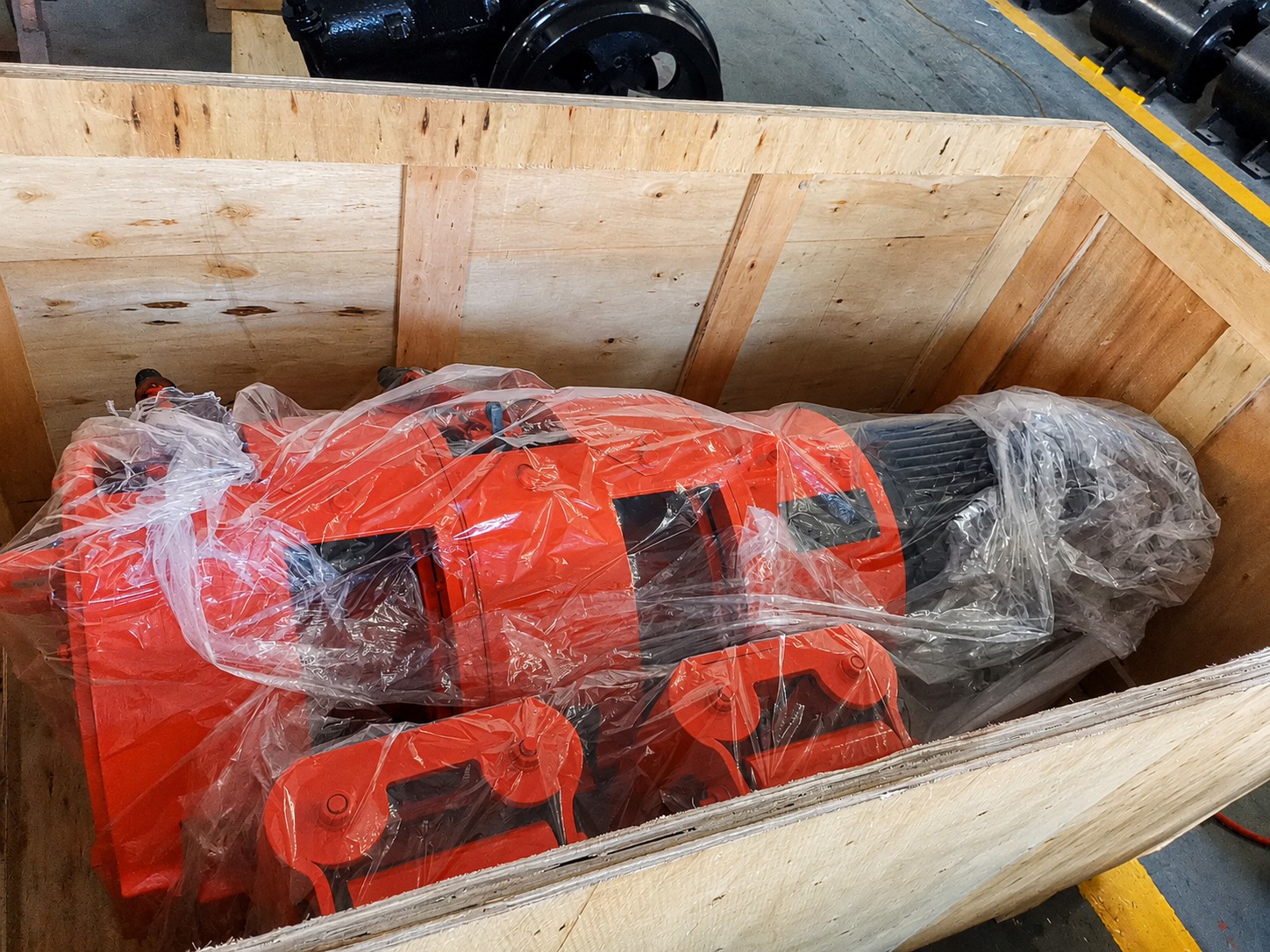The mining rake winch wrapped for protection inside an open wooden case.jpg